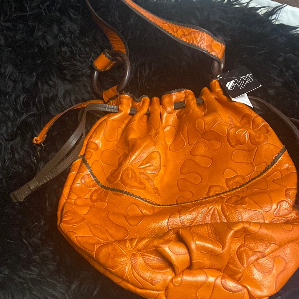 Bold Orange Leather Shoulder Bag with Textured Design